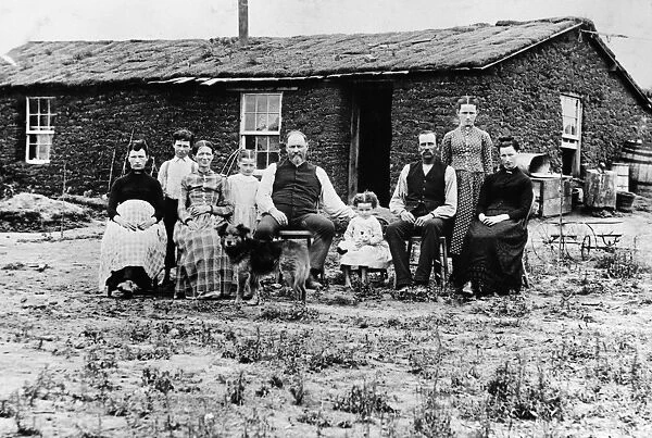 NEBRASKA: SETTLERS, c1890. A homesteader family in front of their sod house in Nebraska