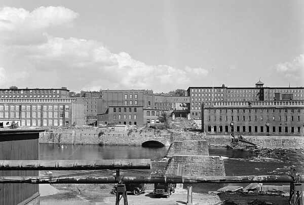 NEW HAMPSHIRE, 1936. View of the Amoskeag mills and remains of the bridge in Manchester