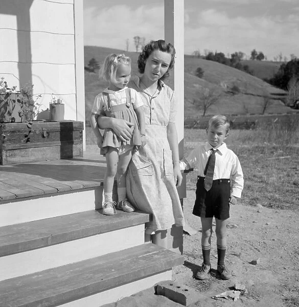 NEW HOME, 1941. The Smith family standing outside of their new home in Riner, Virginia