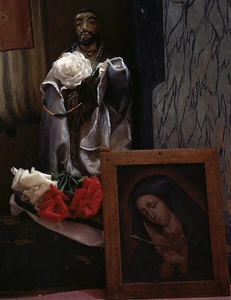 NEW MEXICO: CHURCH, 1943. A santo figure and Mater Dolorosa painting in a church in Trampas