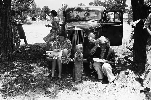 NEW MEXICO: FARMER FAMILY. A family of farmers eating dinner at a community sing in Pie Town