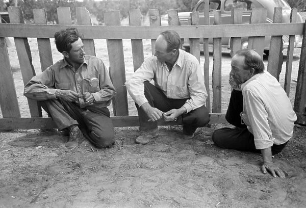 NEW MEXICO: MEN, 1940. Homesteaders talking in Pie Town, New Mexico. Photograph by Russell Lee