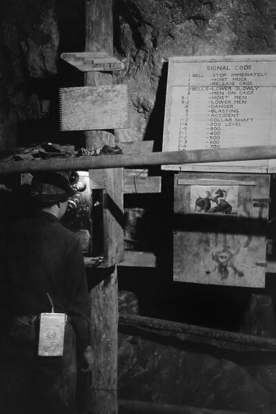 NEW MEXICO: MINING, 1940. A miner on the telephone underground in the gold mine in Mogollon