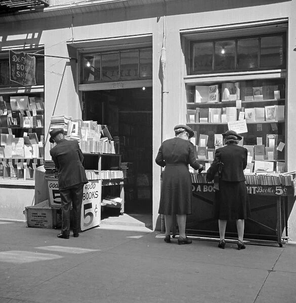 NEW ORLEANS, 1943. Shoppers outside of a book store in New Orleans, Louisiana
