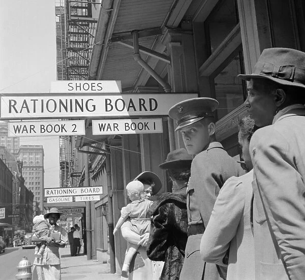 NEW ORLEANS, 1943. A soldier on line at a rationing board in New Orleans, Louisiana