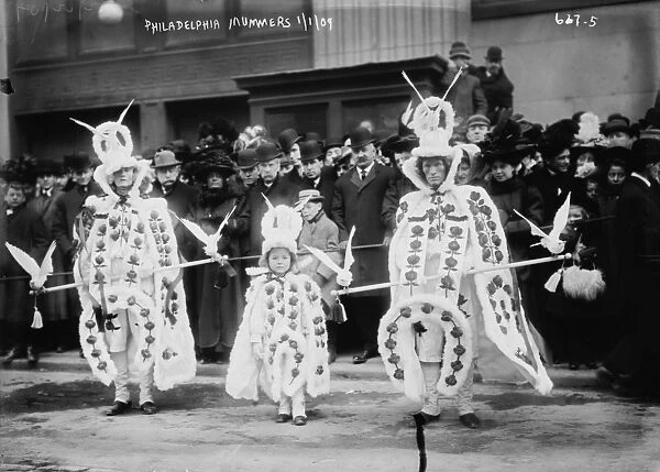 NEW YEAR S: COSTUMES, 1909. People in costume at the Mummers Parade held every