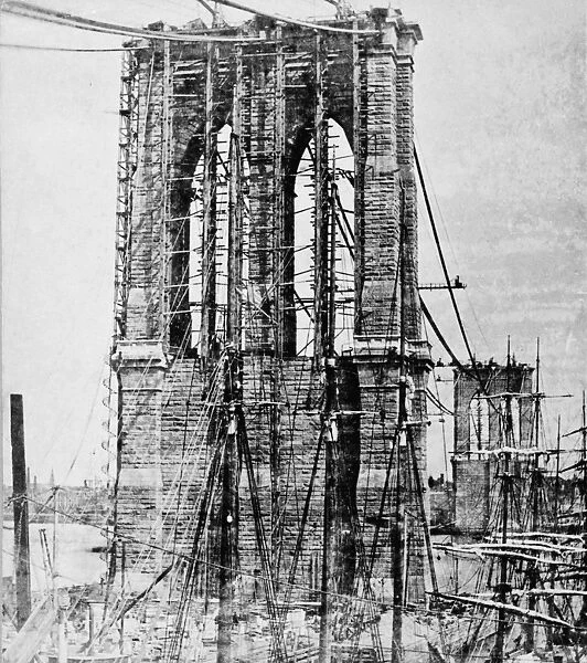 NEW YORK: BROOKLYN BRIDGE. The Brooklyn Bridge under construction over the East