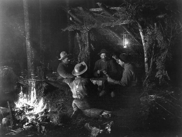 NEW YORK: CAMPING, c1888. Group of men playing cards while camping in the Adirondack Mountains