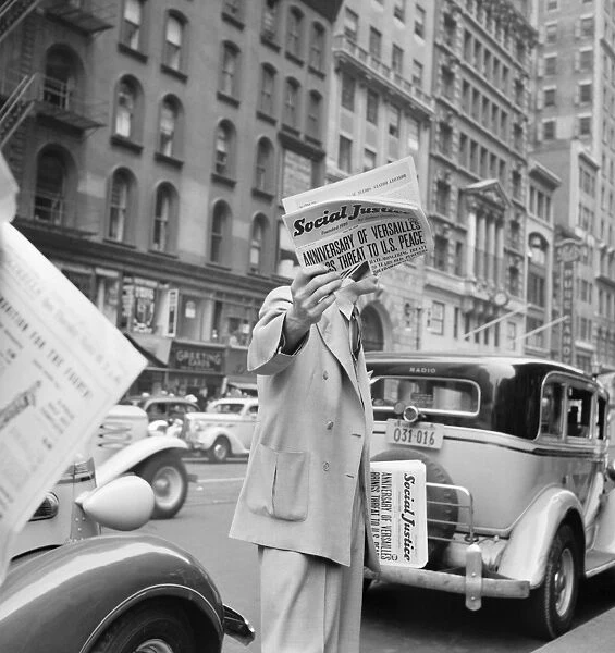 NEW YORK CITY, 1939. A vendor selling Social Justice, an anti-Semitic periodical