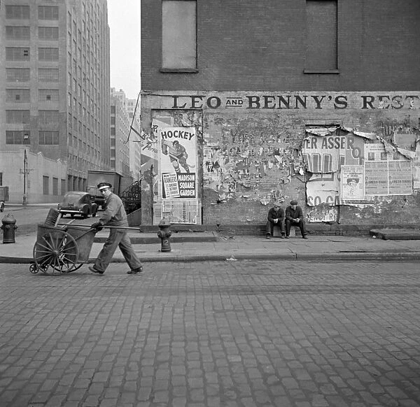 NEW YORK CITY, 1943. A street cleaner on Washington Street in New York City