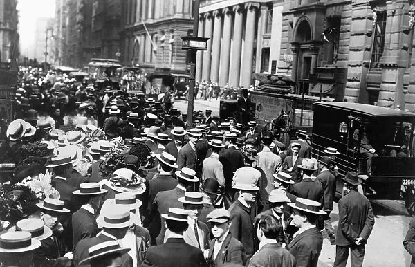 NEW YORK: CROWDED STREET. Crowds gathered outside Trinity Church at the intersection of Broadway