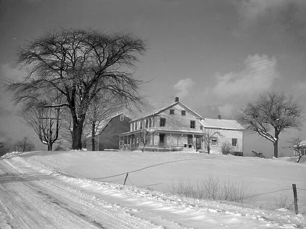 NEW YORK: FARMLAND, 1937. A barn and farmhouse in Oswego County, New York