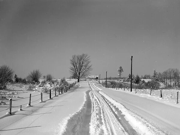 NEW YORK: FARMLAND, 1937. A rural road in Oswego County, New York. Photograph by Arthur Rothstein