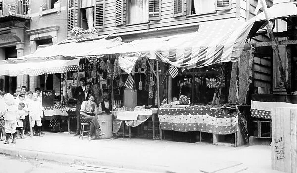 NEW YORK: LITTLE ITALY, c1905. Italian wares on display in front of shops in Little Italy