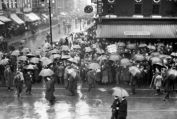 NEW YORK: MAY DAY, 1909. A crowd gathered in the rain for a May Day parade in New York City