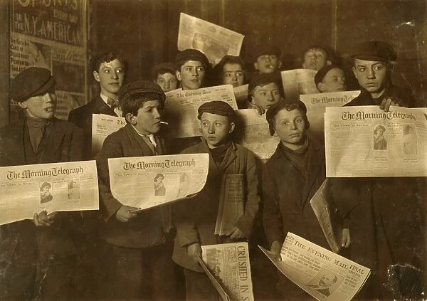 NEW YORK: NEWSBOYS, 1908. A group of newboys at the side door of the Journal Building