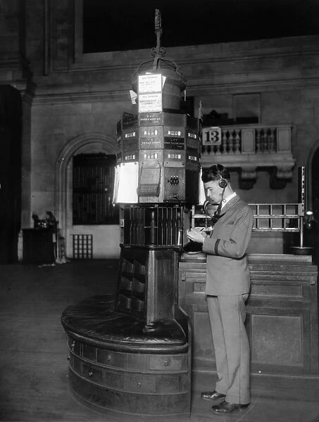 NEW YORK STOCK EXCHANGE. Telephone operator at post of new quotation system. Photograph