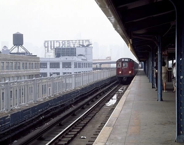 NEW YORK: SUBWAY, c1985. A subway train running the 7 line arrives at an elevated