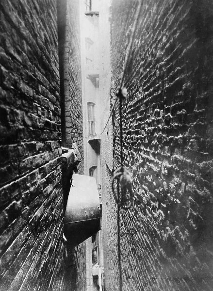 NEW YORK: TENEMENT, c1890. Bathtub stored in a tenement air shaft. Photograph by Jacob A. Riis, c1890