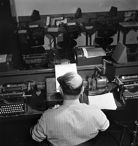 NEW YORK TIMES OFFICE, 1942. A telegraph operator receiving Western Union dispatches