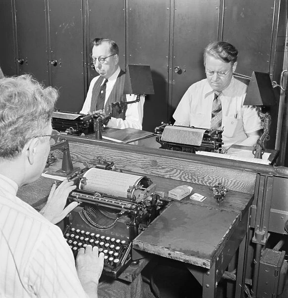 NEW YORK TIMES OFFICE, 1942. Telegraph operators receiving and recording messages