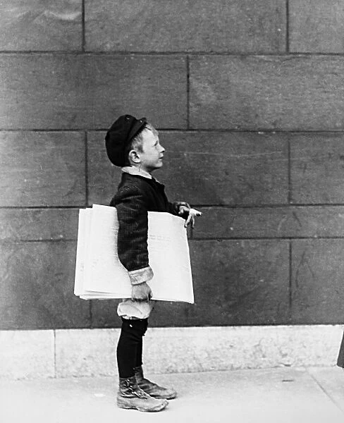 NEWSBOY, 1910. Photographed, c1910, at an unknown location, probably in the North