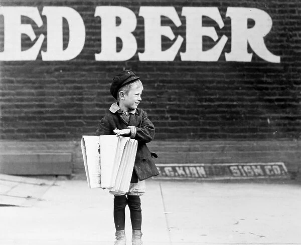NEWSBOY, 1910. Photographed c1910 at an unknown location, probably in the Northeastern