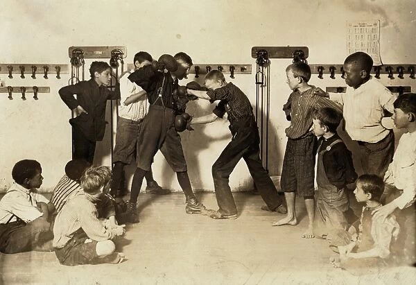 NEWSBOYS BOXING, 1908. A newsboys self-defense class given by the Newsboy Protective