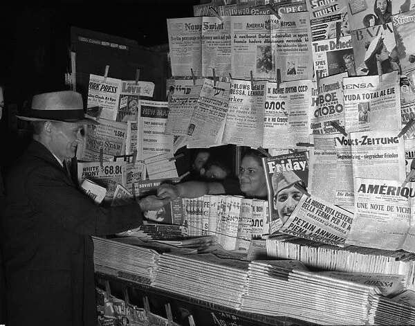 NEWSSTAND, 1941. Foreign language newspapers at an American newsstand. Photograph, 1941