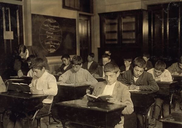 NIGHT SCHOOL, 1909. Working immigrant boys in a evening class for all nationalites in Boston