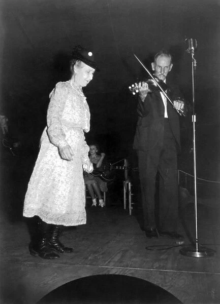 NORTH CAROLINA: FIDDLER. Fiddler Bill Hensley and a woman performing at the Mountain