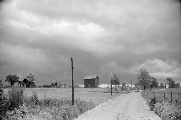 NORTH CAROLINA: STORM, 1940. A country road near Stem, North Carolina. Photograph by Jack Delano