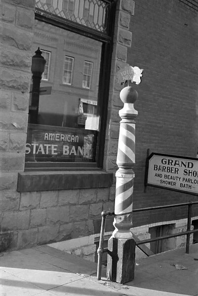 NORTH DAKOTA: BARBER SHOP. Striped pole outside of a barber shop in Williston, North Dakota