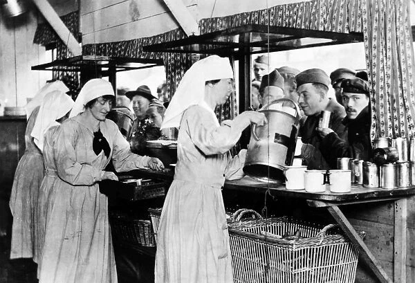 Nurses serving soldiers at an American Red Cross canteen in France, c1918