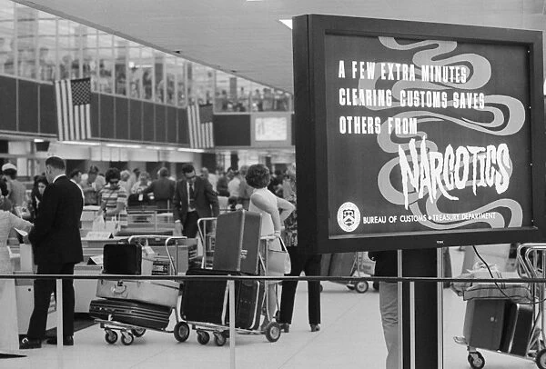NYC: AIRPORT, 1971. Signs at the line for customs and security at John F
