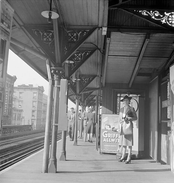 NYC: ELEVATED TRAIN, 1942. A woman waiting at the Third Avenue elevated railway