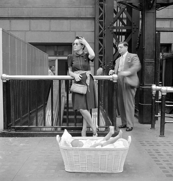 NYC: PENN STATION, 1942. A woman and her baby waiting for their train at Penn Station