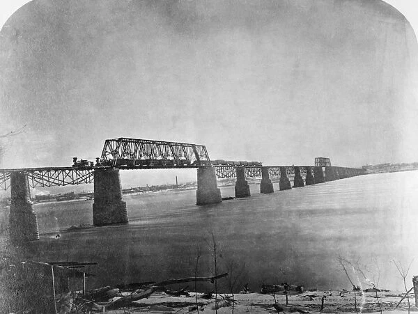 OHIO RIVER BRIDGE, 1870. The first passenger train passing over the Great Ohio River Bridge at Louisville, Kentucky, 18 February 1870