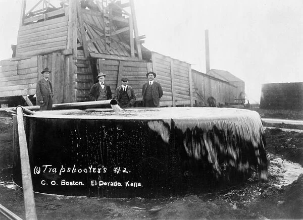 An oil well with storage tank at El Dorado, Kansas. Photographed c1917