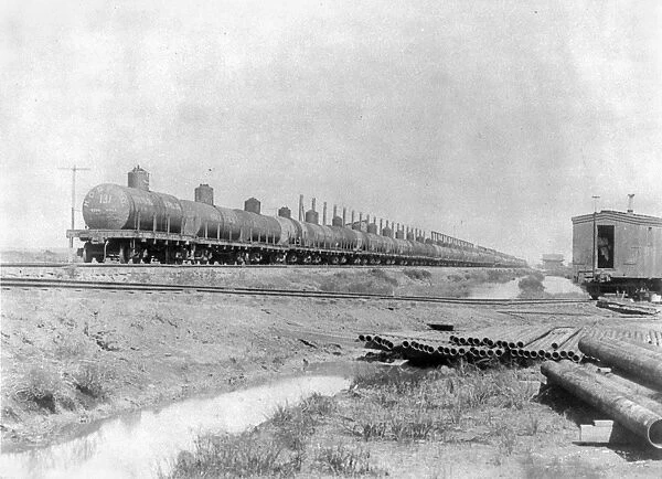 Oil tank cars on a railroad near Spindletop oil field in Texas, c1901
