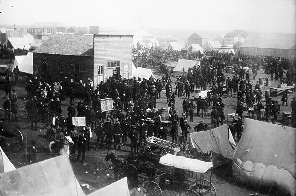 OKLAHOMA LAND RUSH. Land claimants outside the land office at a town in Oklahoma