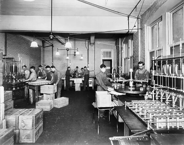 OLIVE OIL PACKAGING. Men at work at the Pompeian Olive Oil distribution company in Baltimore