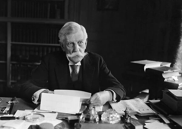 OLIVER WENDELL HOLMES, JR. (1841-1935). American jurist. Photographed seated at his desk