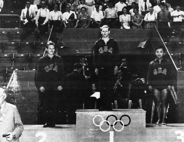 OLYMPIC GAMES, 1948. Bruce Harlan (center), Miller Anderson (left), and Sammy Lee of the United States, winners, respectively, of the gold, silver, and bronze medals in the mens springboard diving event at the Summer Olympic Games in London, England, standing on the winners podium at Wembley Stadium, 31 July 1948 (photograph transmitted by radio)