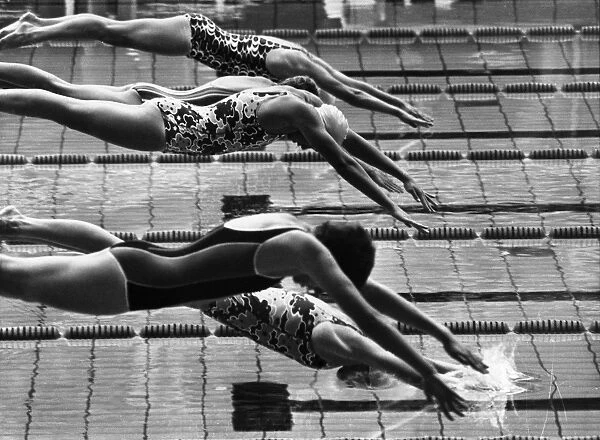 OLYMPIC GAMES, 1972. Swimmers diving into the pool during the womens 400-meter freestyle event at the Summer Olympic Games in Munich, West Germany, 30 August 1972. Shane Gould of Australia, who would win the gold, is wearing a bathing cap at center