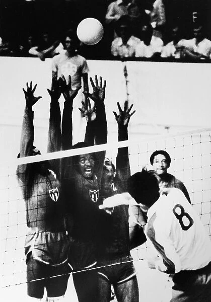 OLYMPICS: VOLLEYBALL, 1976. Mikiyasu Tanaka of Japan tries to spike the ball past the Cuban team at a game during the 1976 Summer Olympics in Montreal, Canada