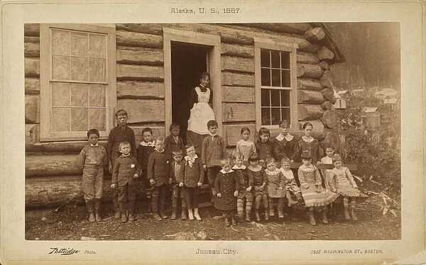 ONE-ROOM SCHOOLHOUSE, 1887. The teacher and students of a one-room schoolhouse in Juneau