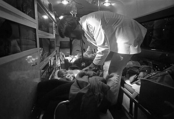 OPERATION BABYLIFT, 1975. Medical staff examining a refugee child upon his arrival