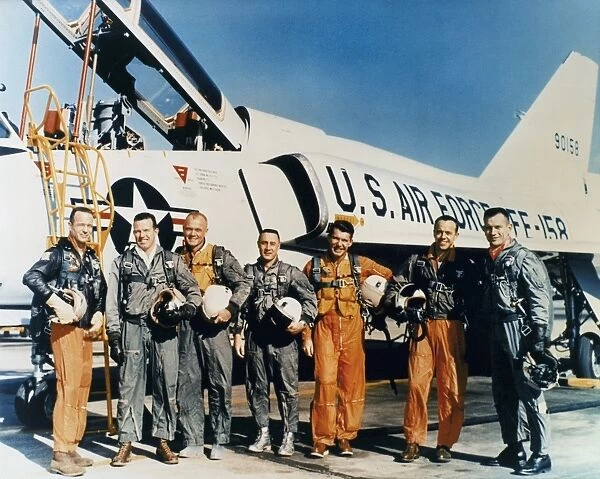 The original seven astronauts of the Mercury Program. Left the right: Scott Carpenter, Gordon Cooper, John Glenn, Virgil Gus Grissom, Walter Schirra, Alan Shepard and Donald Slayton. Photographed in front of a Convair F-106 plane, c1961