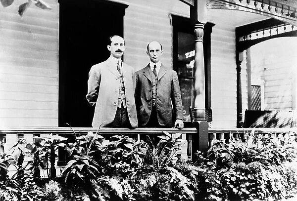 Orville, left (1871-1948), and Wilbur Wright (1867-1912) on their porch in Dayton, Ohio, c1910